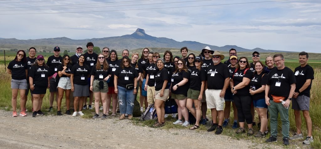 Group shot of workshop participants in front of Heart Mountain