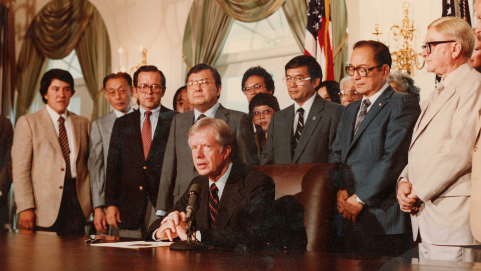 President Jimmy Carter signs a bill
