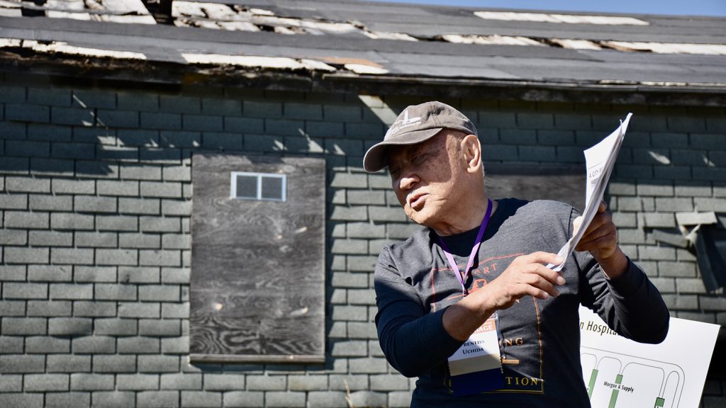 Prentiss Uchida leading a tour of the hospital at the Heart Mountain Pilgrimage
