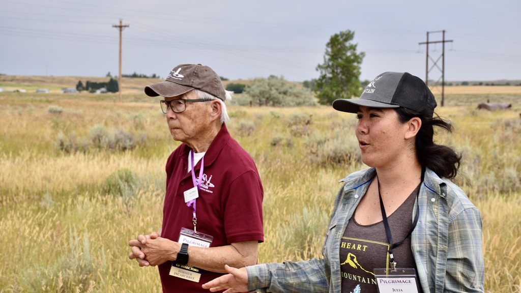 Sam Mihara and Julia Ishiyama, Heart Mountain board members, lead a tour of the camp hospital site during the 2024 Heart Mountain Pilgrimage.