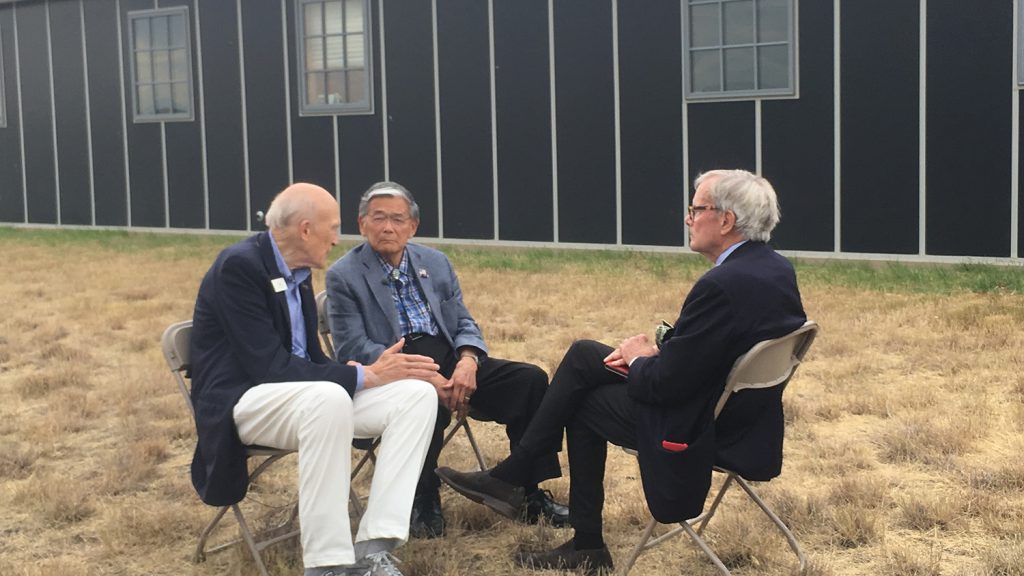Tom Brokaw interviews Norman Mineta and Alan Simpson in front of the original Heart Mountain barrack